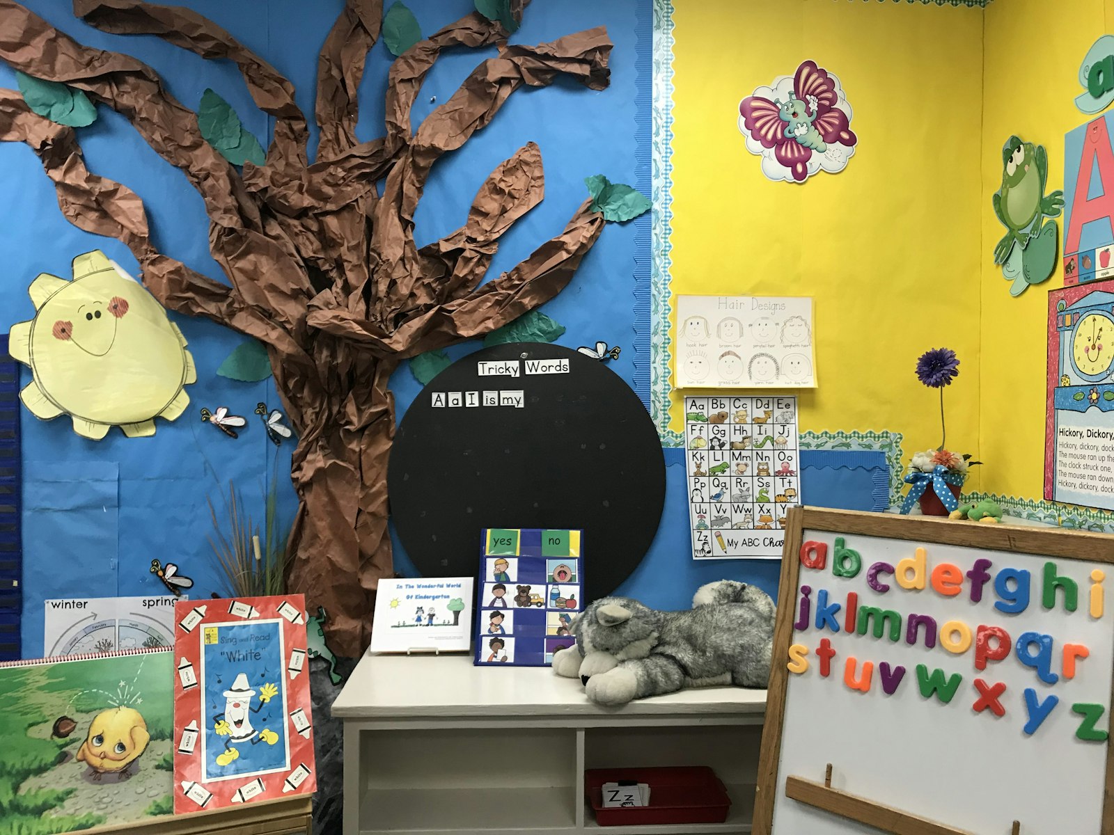 Early childhood centre learning wall with alphabet display and reading materials