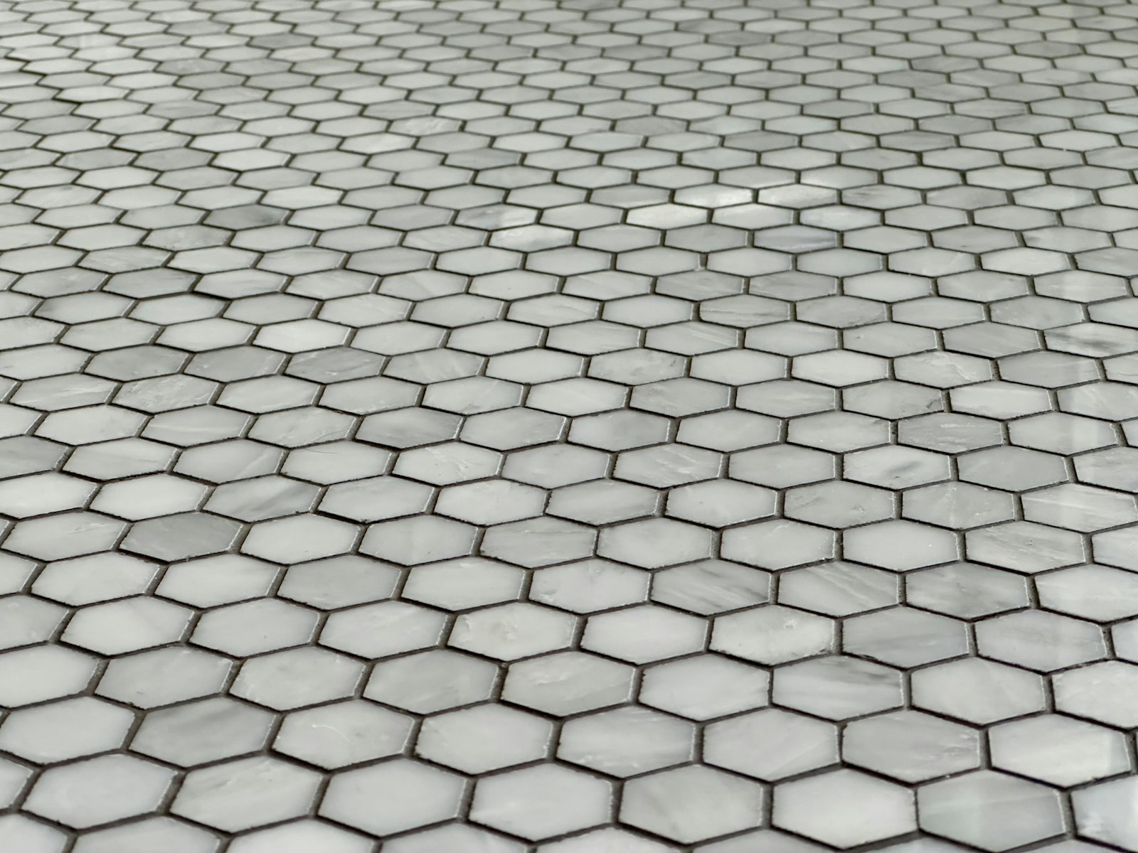 Tiled floor showing the grout lines that discolour first