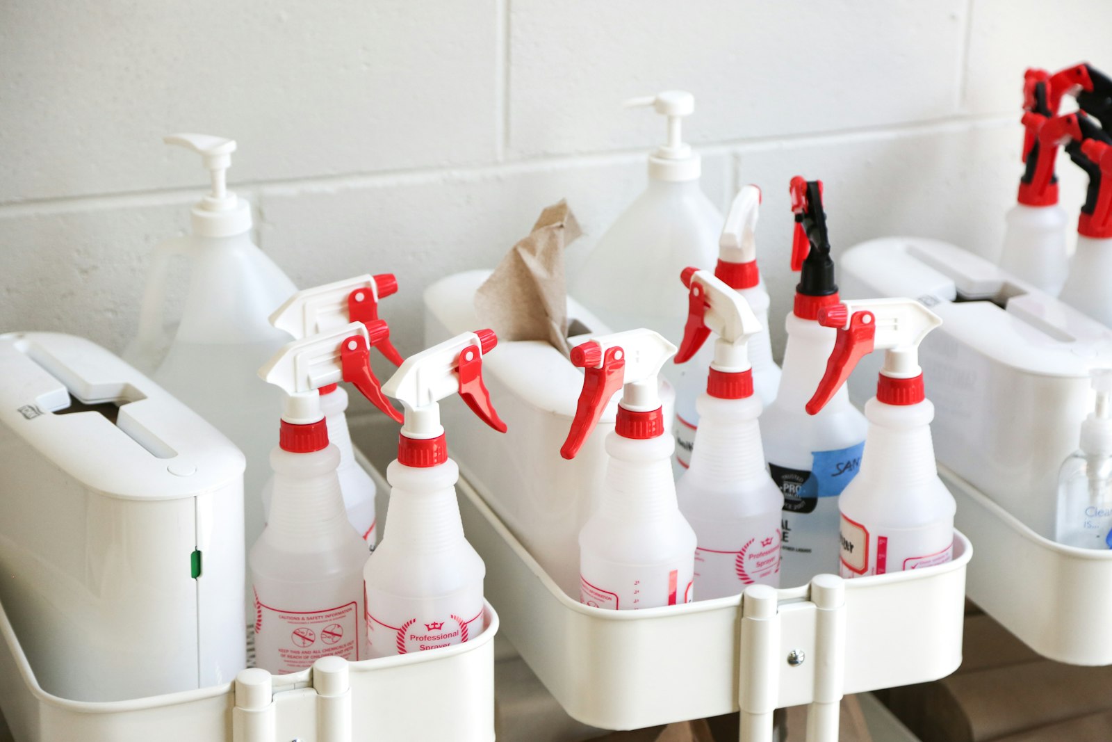 Cleaning products in labelled spray bottles ready for use